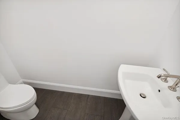 a bathroom with a toilet and sink
