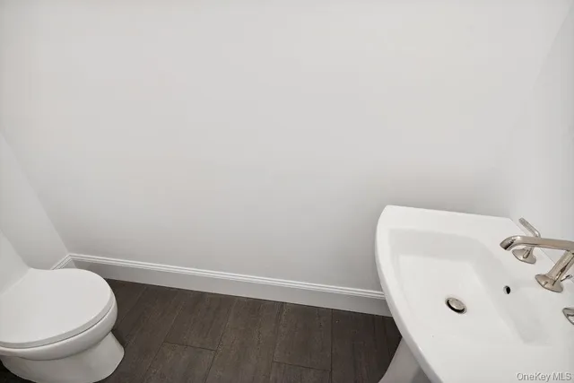 a bathroom with a toilet and sink