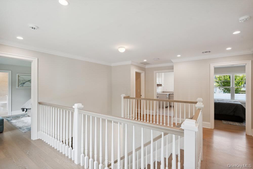 46 Plainview Road Woodbury, NY 11797 - Photo 21 of 46 a view of a hallway with bedroom and wooden floor