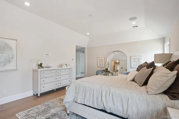 a bedroom with a bed and a dresser