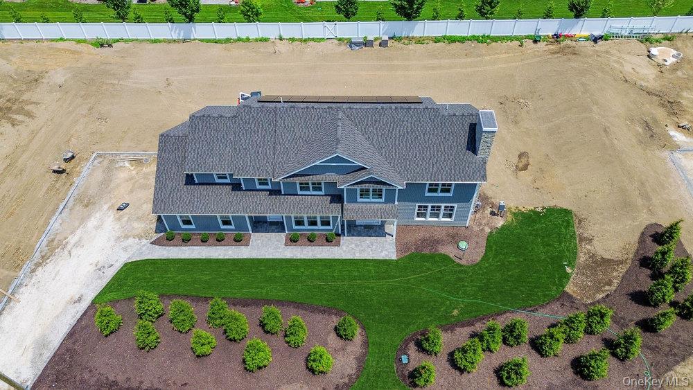 46 Plainview Road Woodbury, NY 11797 - Photo 45 of 46 a aerial view of a house with a garden and plants