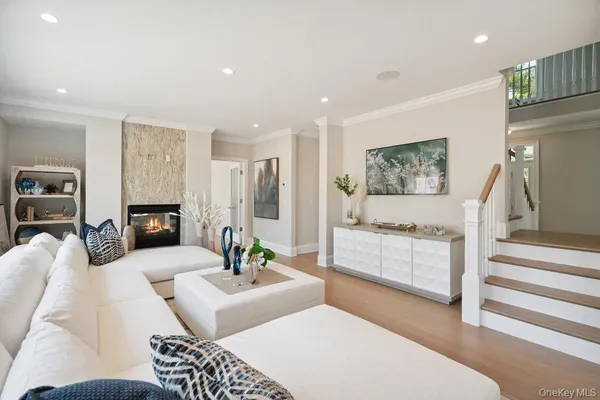 a living room with furniture a table and a window
