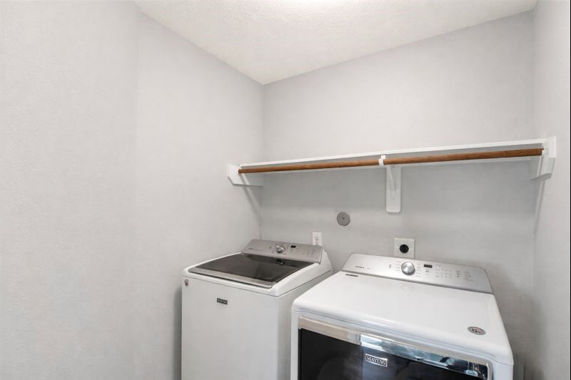 1726 Sun Point Court Humble, TX 77396 - Photo 17 of 26 a utility room with dryer and washer
