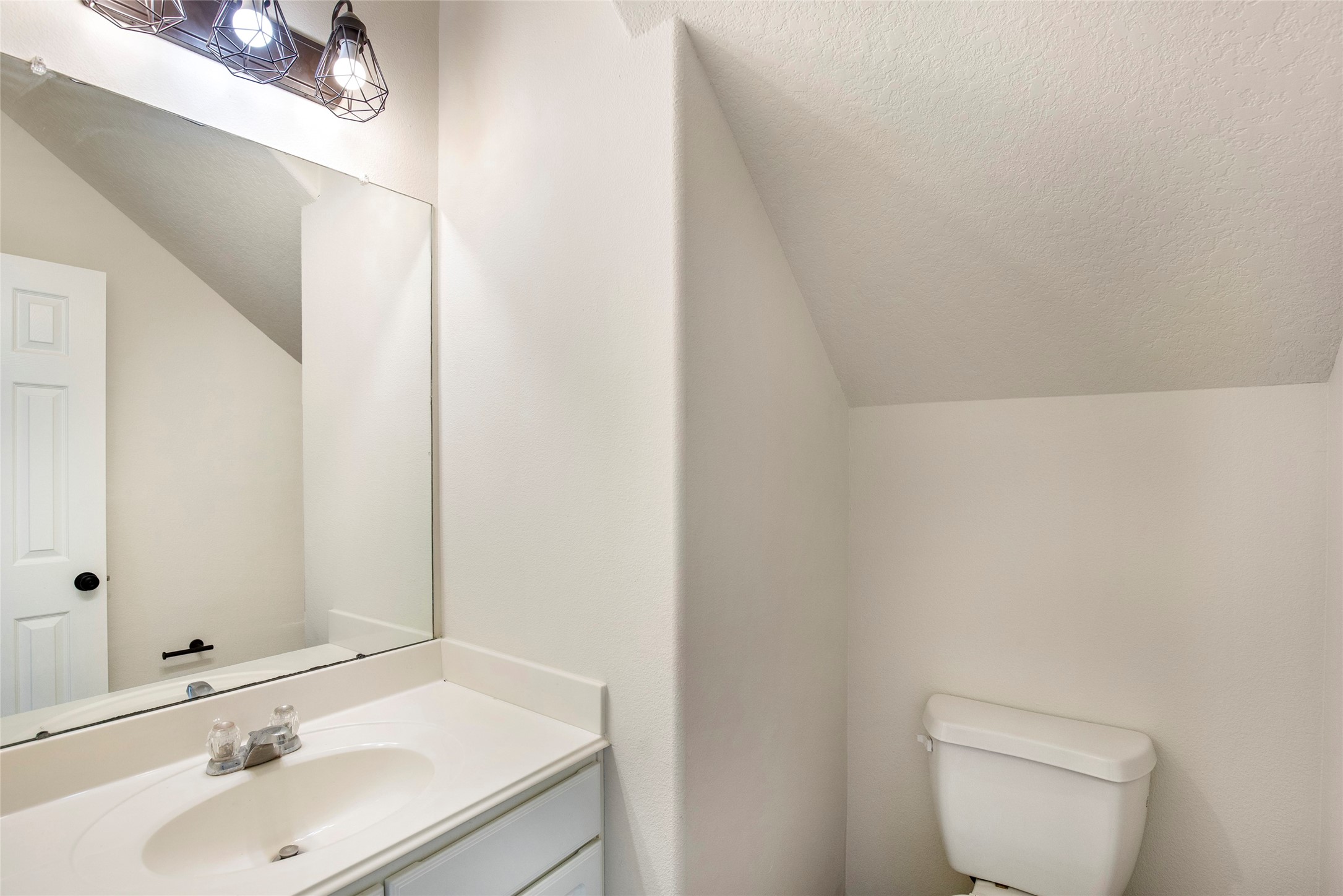 1726 Sun Point Court Humble, TX 77396 - Photo 18 of 26 a bathroom with a sink and a toilet