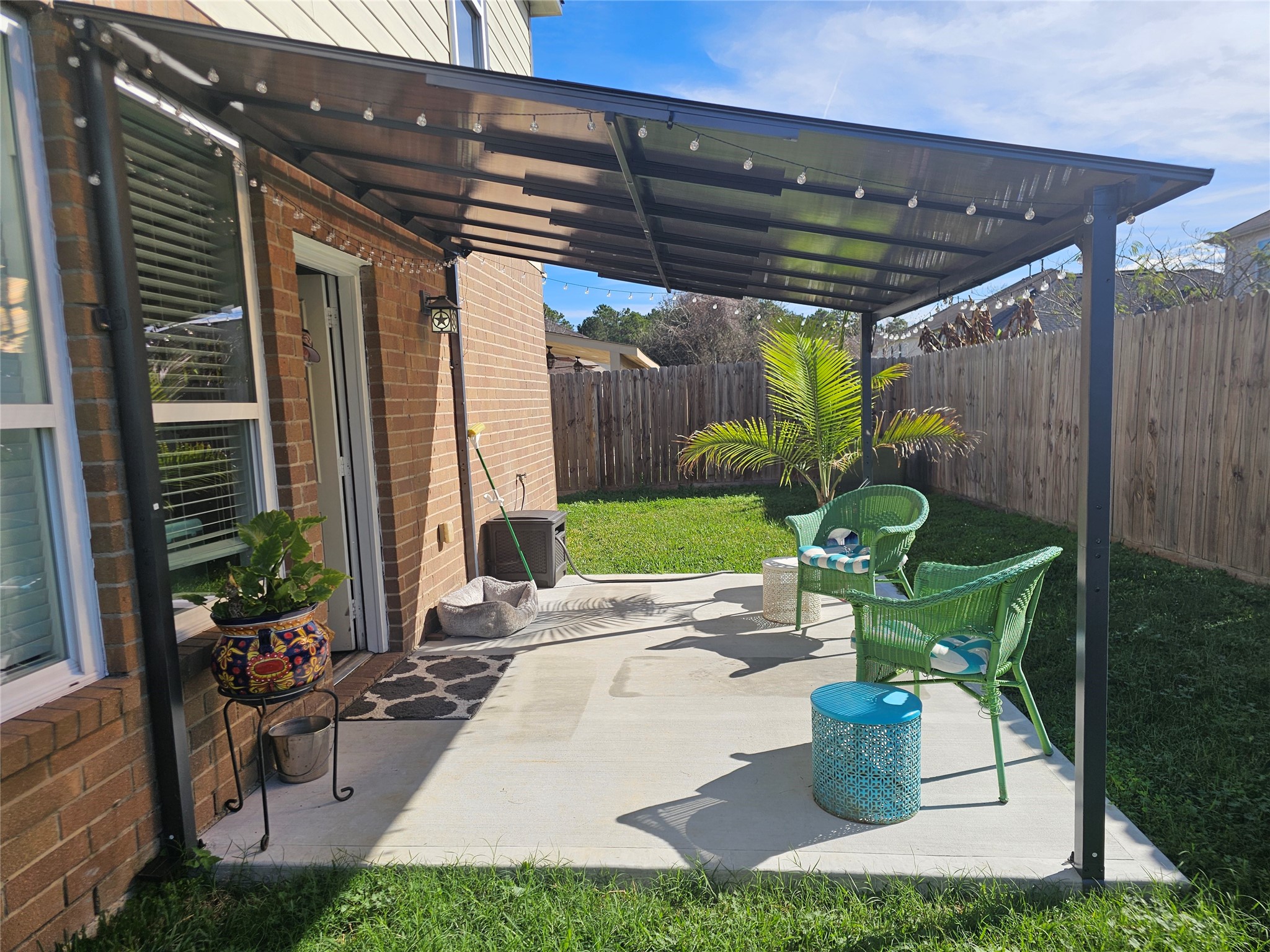 1726 Sun Point Court Humble, TX 77396 - Photo 23 of 26 a patio with table and chairs