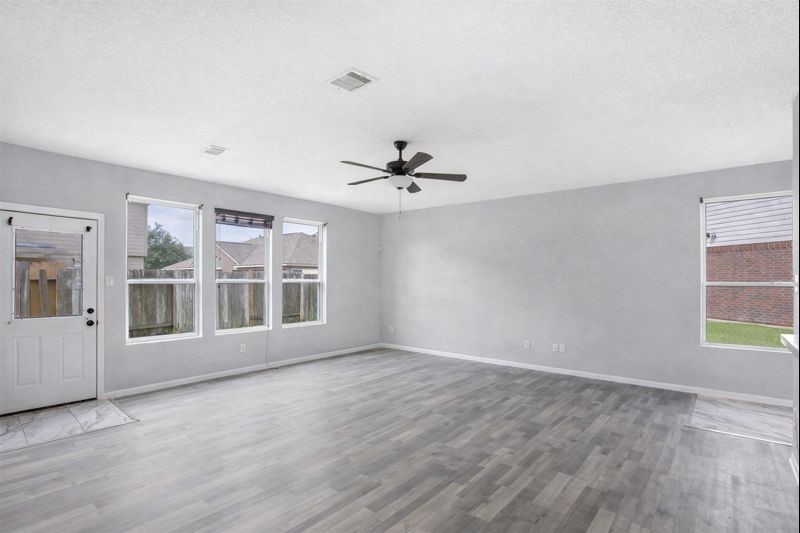 1726 Sun Point Court Humble, TX 77396 - Photo 7 of 26 a view of an empty room with a window