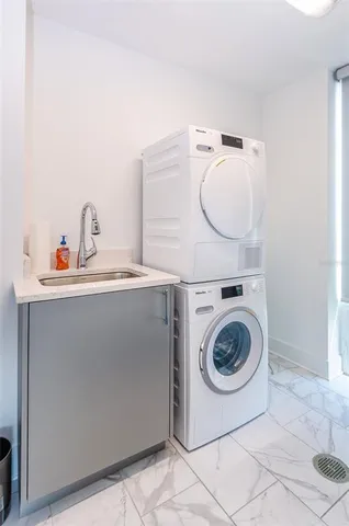 a utility room with dryer and washer
