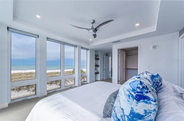 a bedroom with a large bed and a window