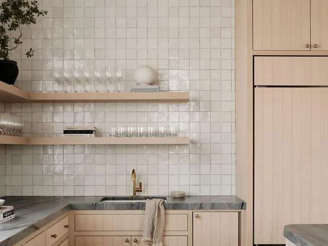 a kitchen with a sink and cabinets