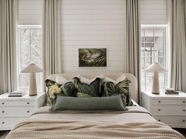 a bedroom with a bed and a window with outer view