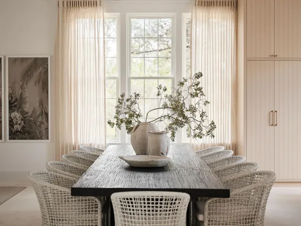 a view of a dining room with furniture and a window