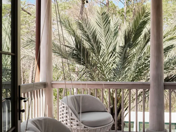 a view of a balcony with furniture