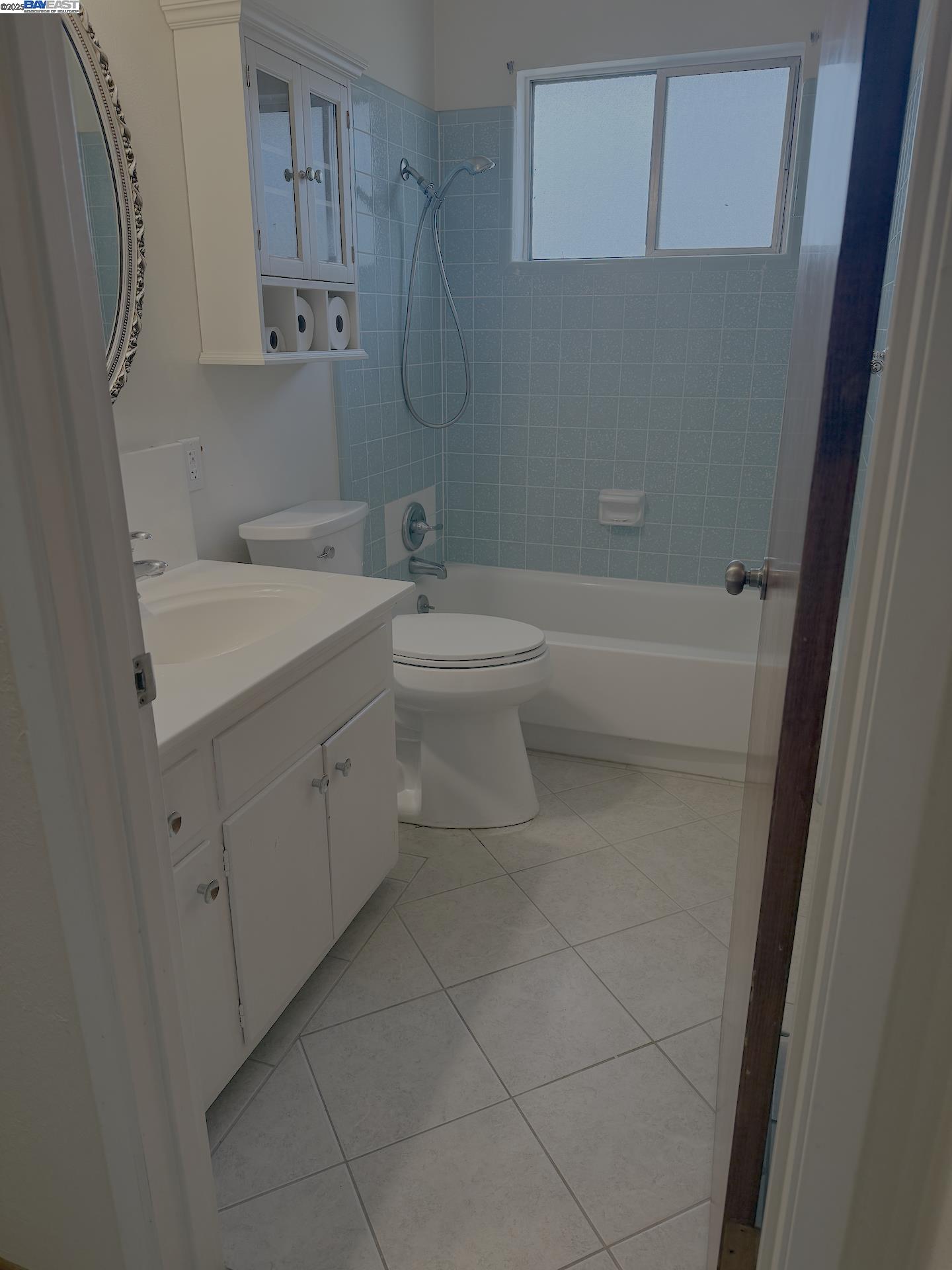 701 North 3rd Street Patterson, CA 95363 - Photo 12 of 23 a bathroom with a sink a toilet and a bathtub