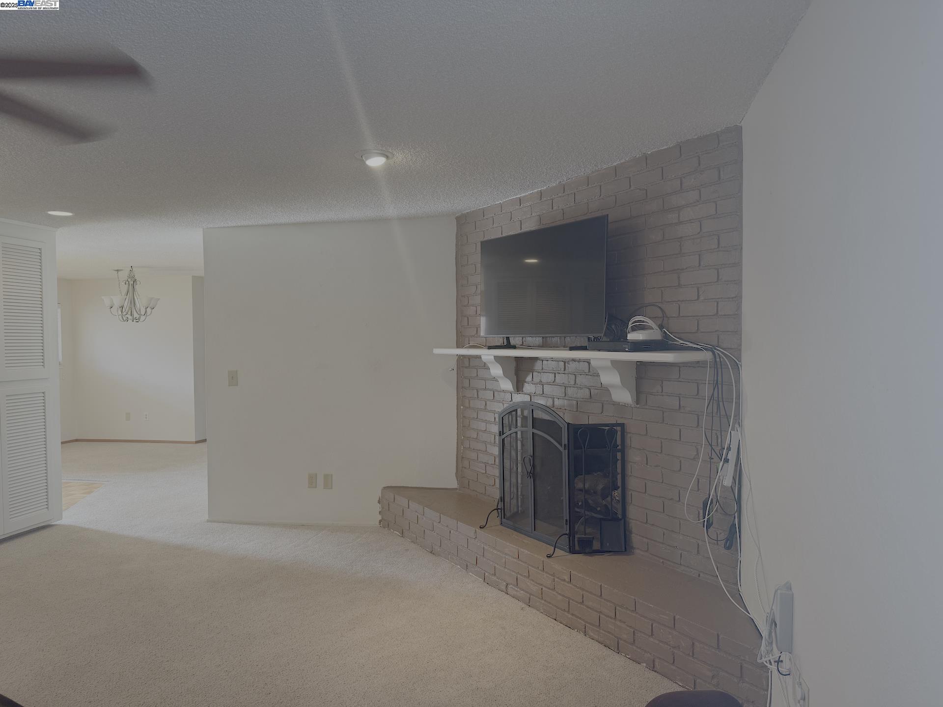 701 North 3rd Street Patterson, CA 95363 - Photo 15 of 23 a view of a fireplace in kitchen