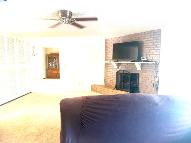 a bedroom with a bed and a fireplace