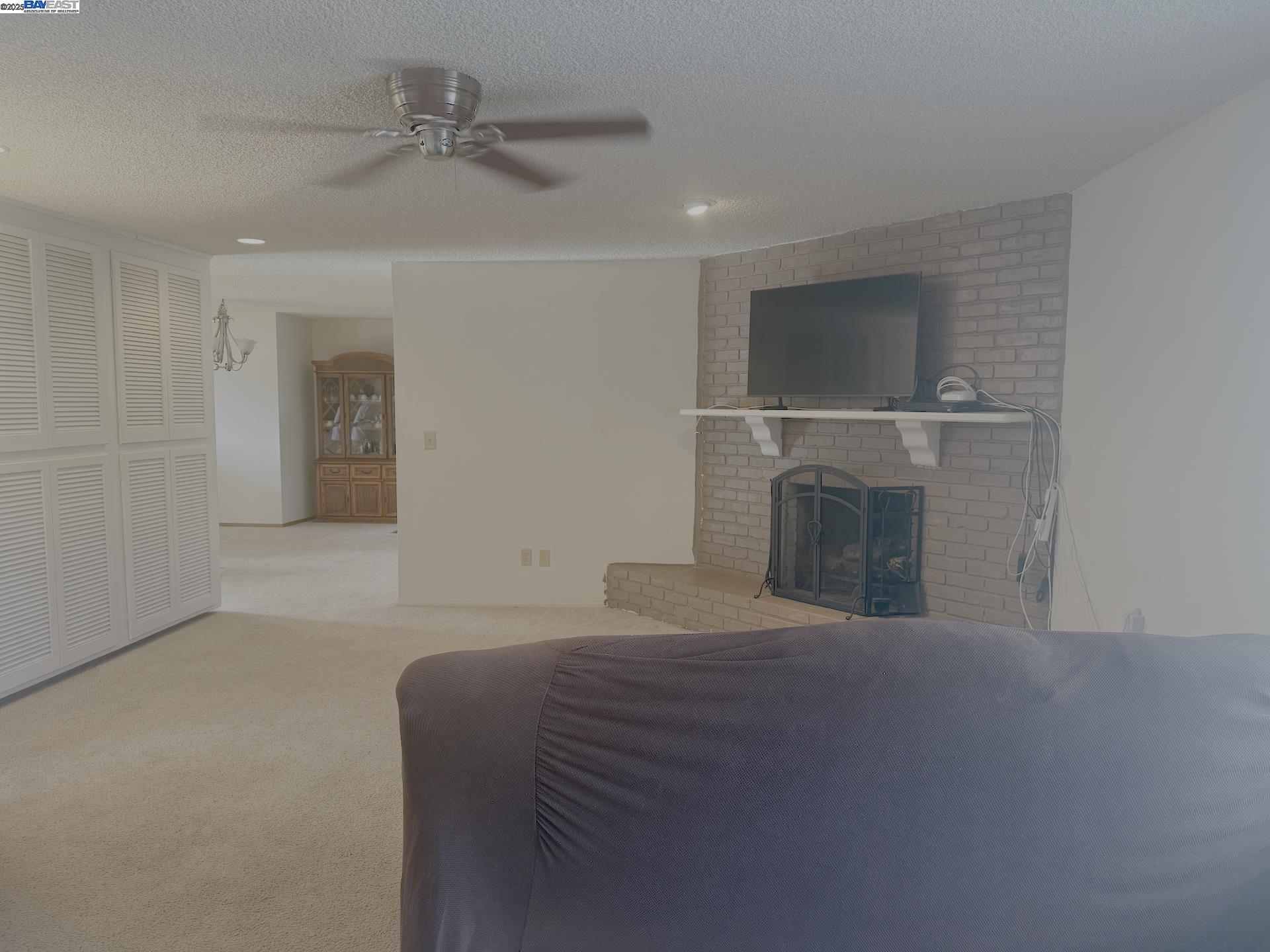 701 North 3rd Street Patterson, CA 95363 - Photo 17 of 23 a bedroom with a bed and a fireplace