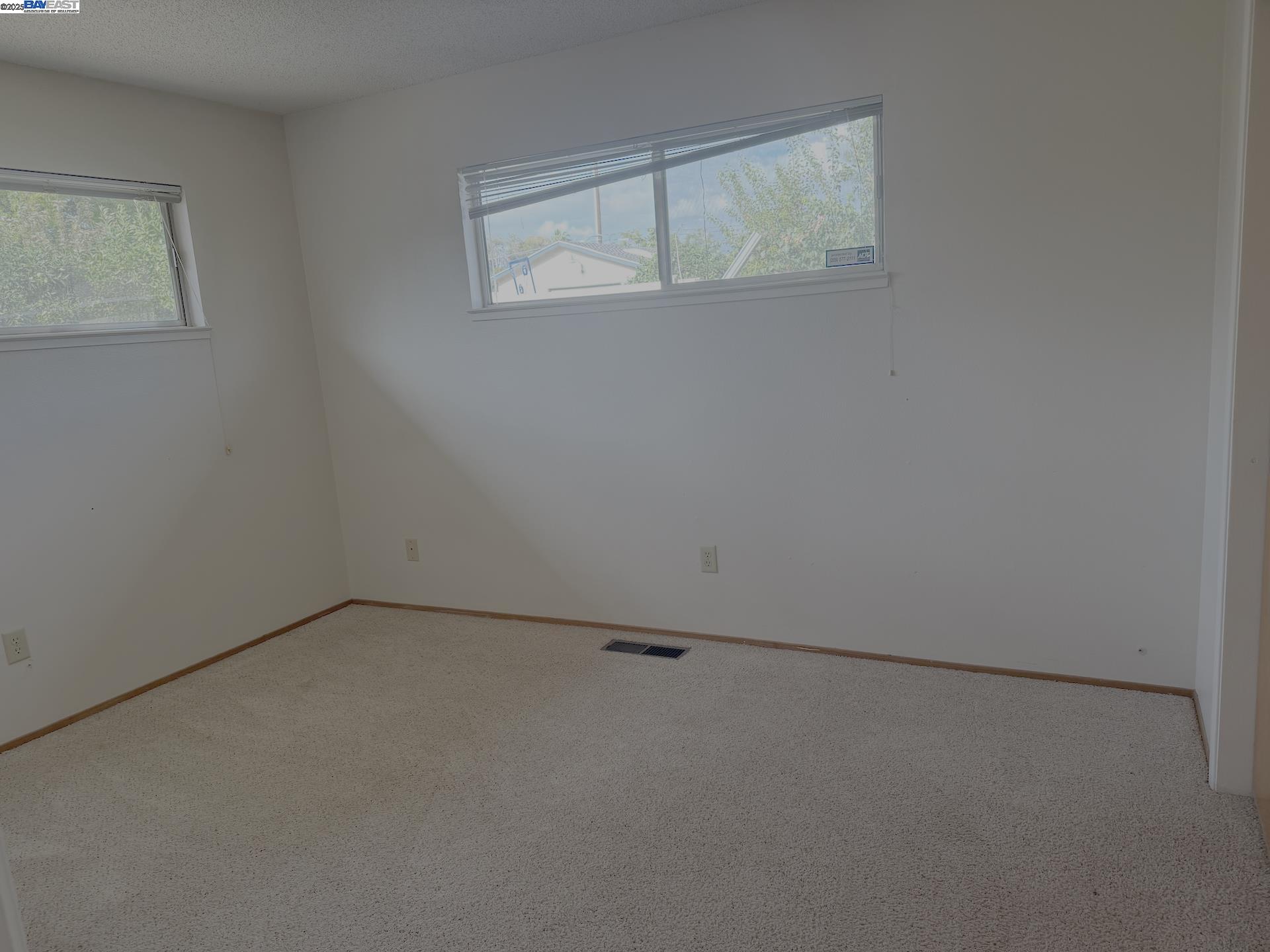 701 North 3rd Street Patterson, CA 95363 - Photo 20 of 23 an empty room with a window