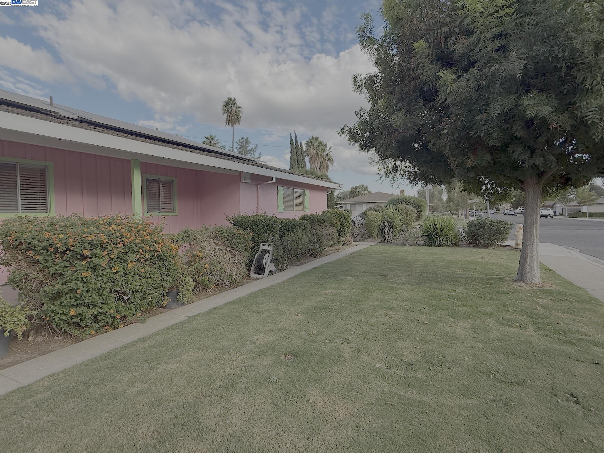 701 North 3rd Street Patterson, CA 95363 - Photo 8 of 23 a view of a house with a yard
