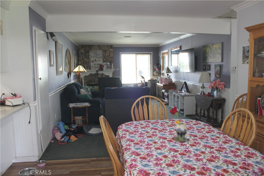 5911 Green Valley Road Riverside, CA 92504 - Photo 8 of 24 a bedroom with a bed a dresser and mirror