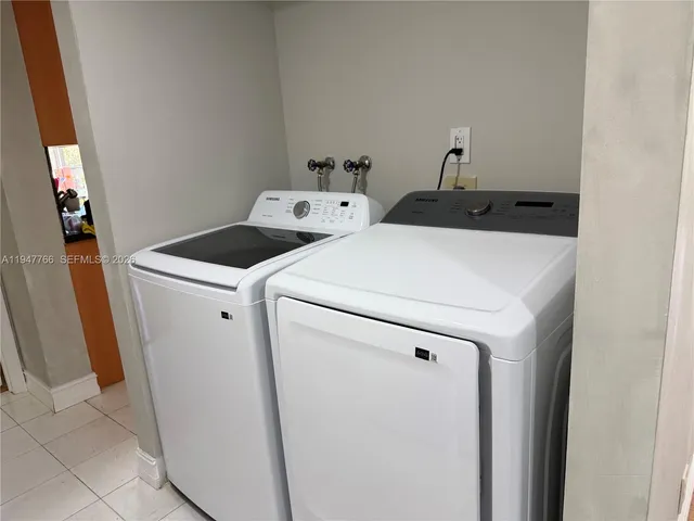 a bedroom with a bed and a night stand