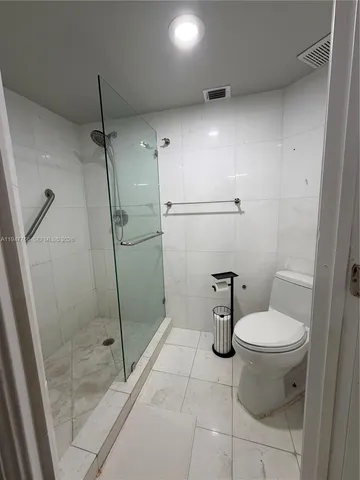 a view of balcony with two chairs and wooden floor