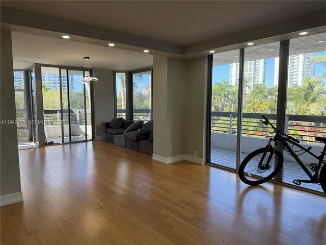 a living room with furniture and windows