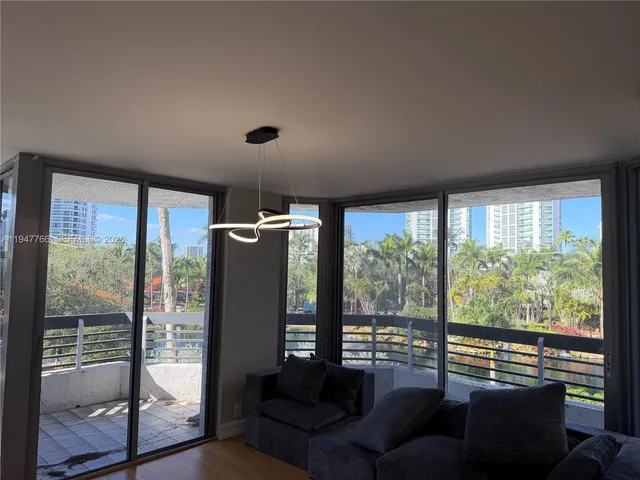 a view of room with furniture and large window