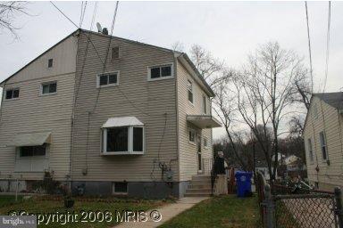 12121 Bluhill Road Silver Spring, MD 20902 - Photo 1 of 1 a front view of a house with a yard