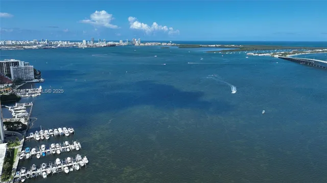 an aerial view of multi story residential apartment building with yard