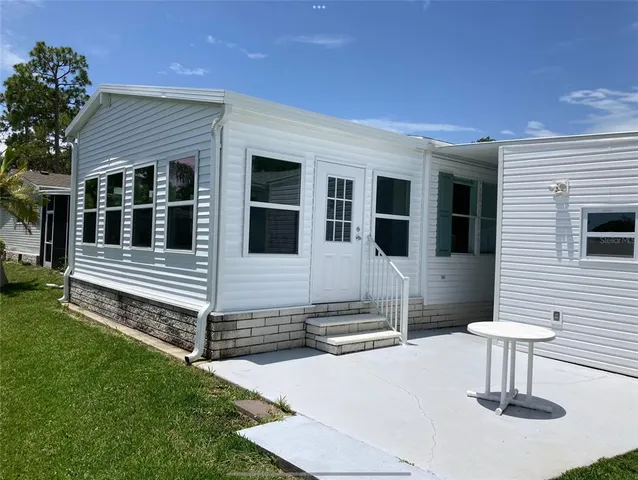 a house view with a backyard space