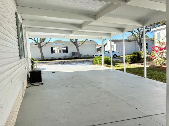 a view of a porch and garage