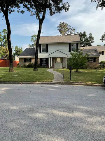 front view of a house with a street