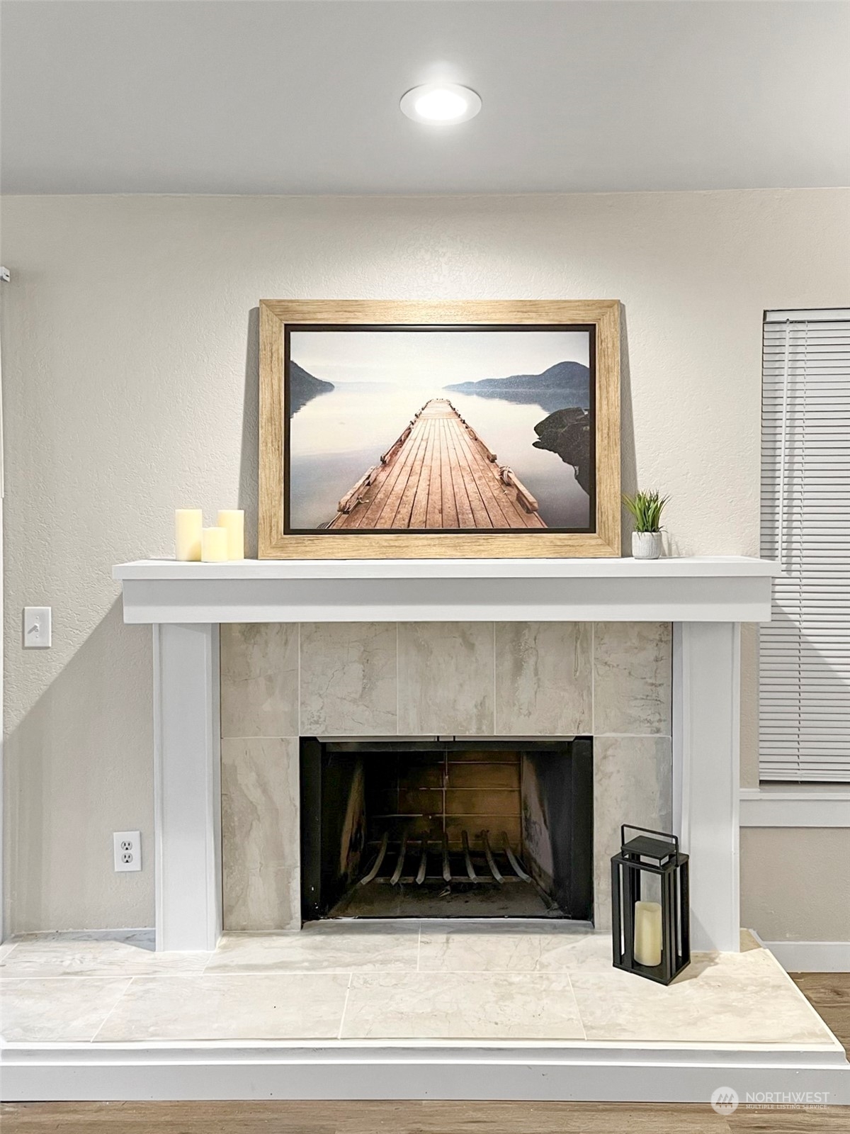 14401 Southeast Petrovitsky Road, Unit C103 Renton, WA 98058 - Photo 16 of 29 a living room with a fireplace and cabinets
