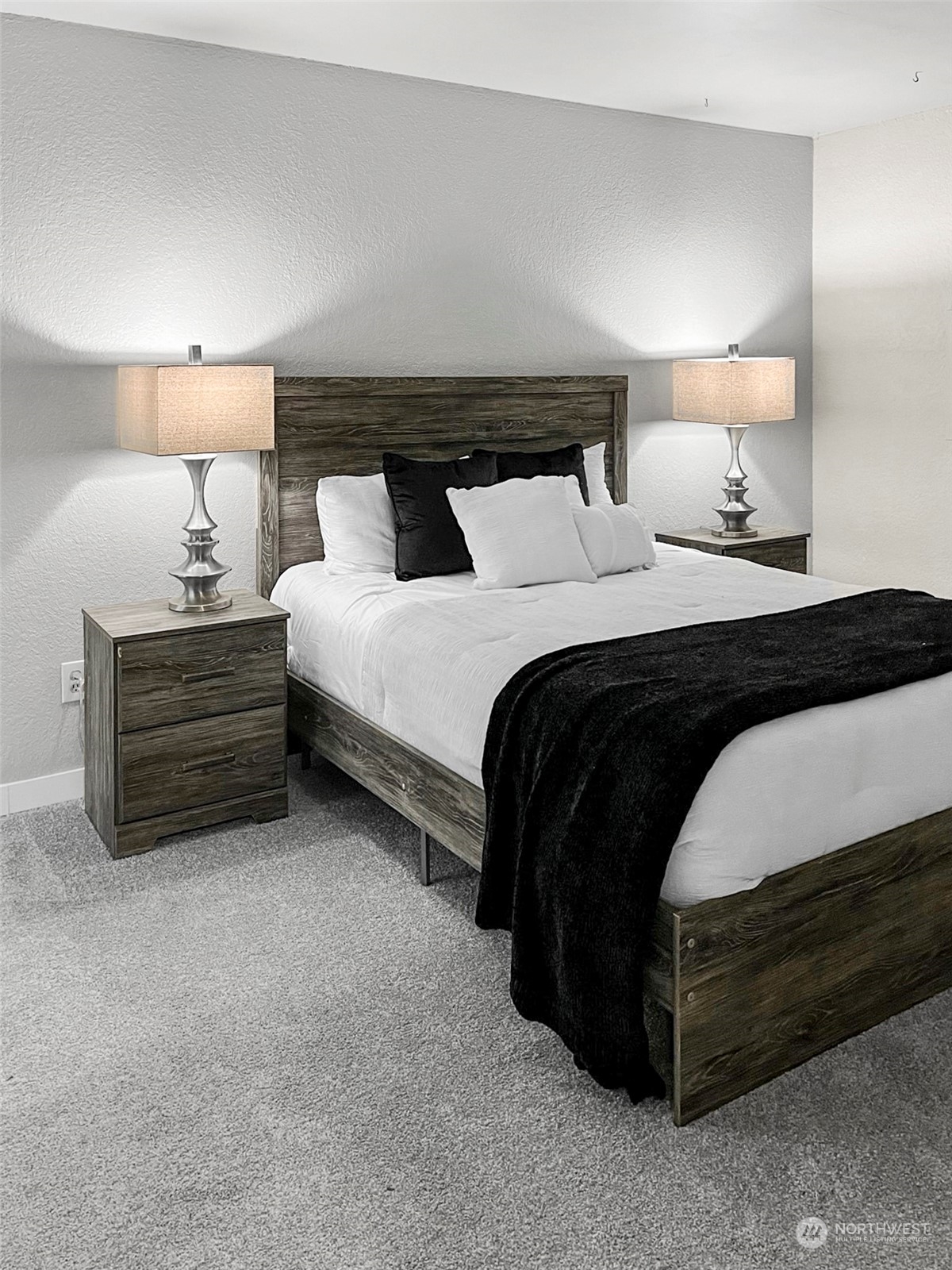14401 Southeast Petrovitsky Road, Unit C103 Renton, WA 98058 - Photo 17 of 29 a bedroom with bed lamp and a lamp