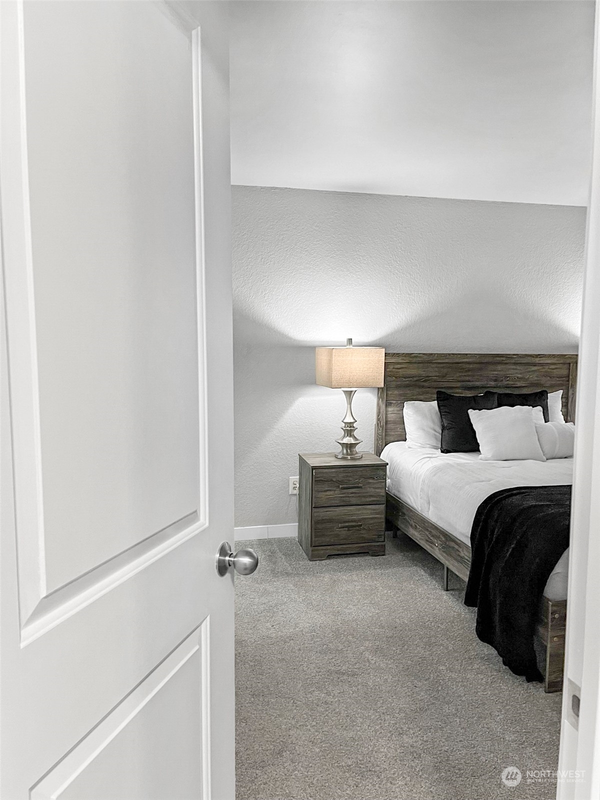 14401 Southeast Petrovitsky Road, Unit C103 Renton, WA 98058 - Photo 18 of 29 a bedroom with a bed and a window