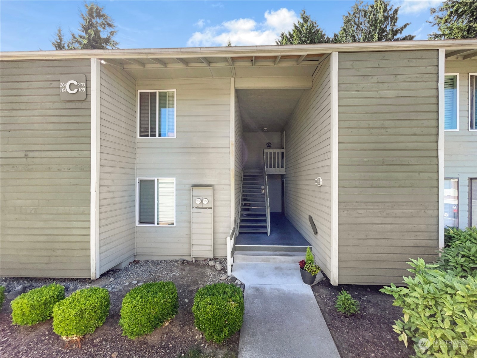 14401 Southeast Petrovitsky Road, Unit C103 Renton, WA 98058 - Photo 20 of 29 a front view of a house with a porch