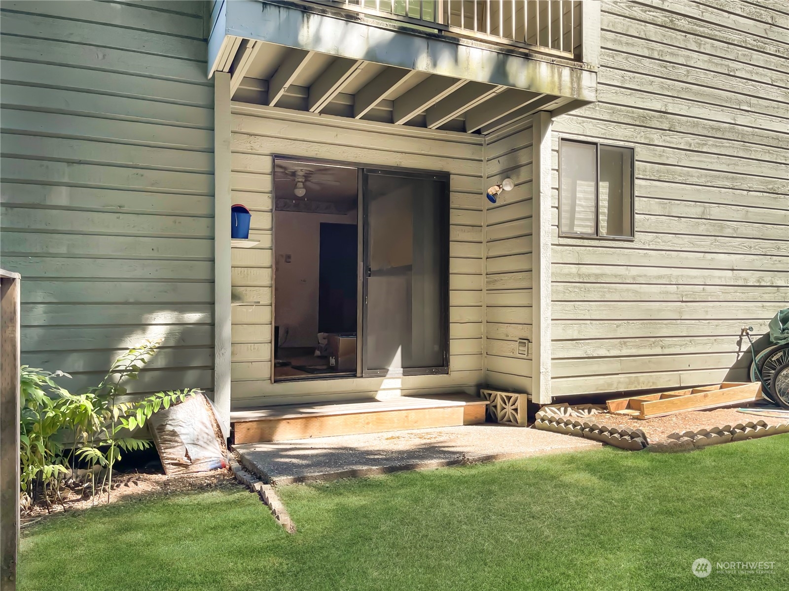 14401 Southeast Petrovitsky Road, Unit C103 Renton, WA 98058 - Photo 22 of 29 a front view of a house with a yard