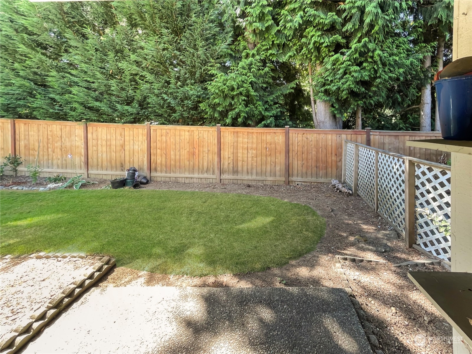 14401 Southeast Petrovitsky Road, Unit C103 Renton, WA 98058 - Photo 23 of 29 a view of a yard with wooden fence