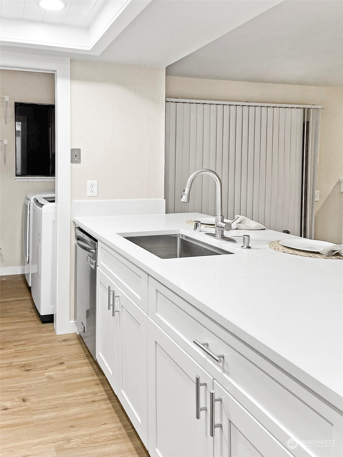 14401 Southeast Petrovitsky Road, Unit C103 Renton, WA 98058 - Photo 8 of 29 a close view of a sink and a black white checkered floor