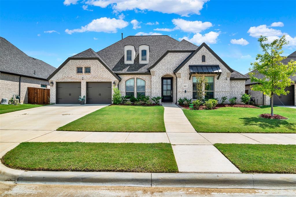 1004 Open Range Drive Mansfield, TX 76063 - Photo 2 of 40 a front view of a house with a yard