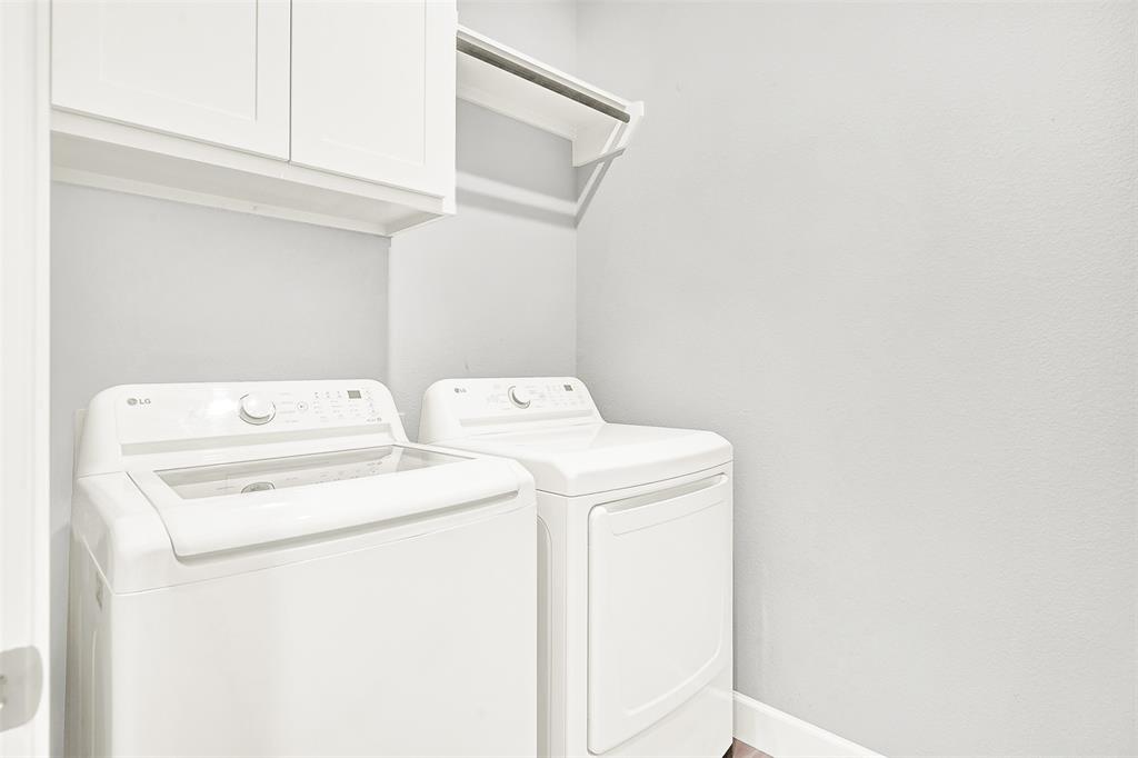 1004 Open Range Drive Mansfield, TX 76063 - Photo 24 of 40 a utility room with dryer and washer