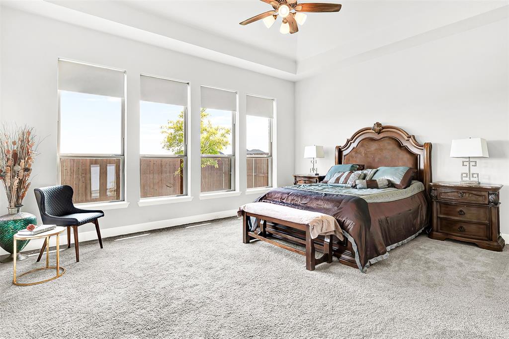 1004 Open Range Drive Mansfield, TX 76063 - Photo 25 of 40 a bedroom with a bed chair and a window