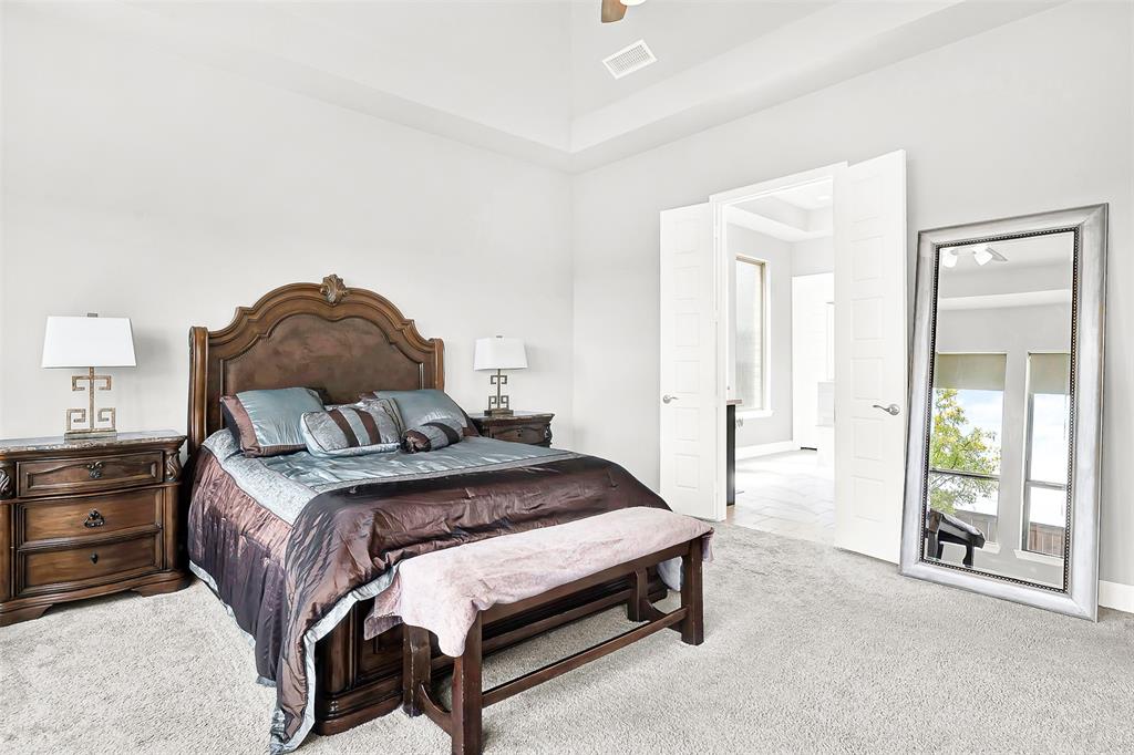 1004 Open Range Drive Mansfield, TX 76063 - Photo 26 of 40 a bedroom with a bed and large window