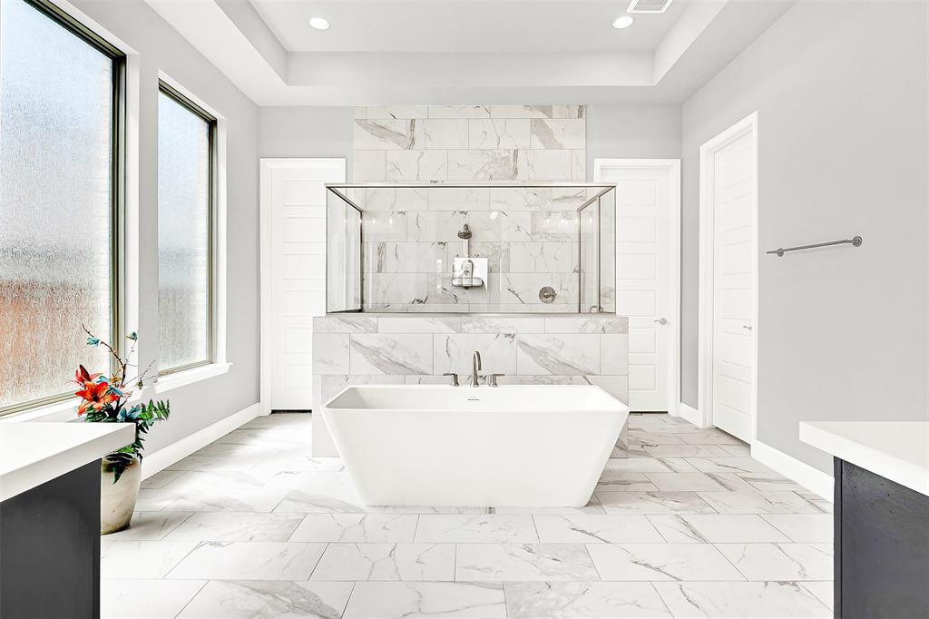 1004 Open Range Drive Mansfield, TX 76063 - Photo 27 of 40 a spacious bathroom with a bathtub and shower