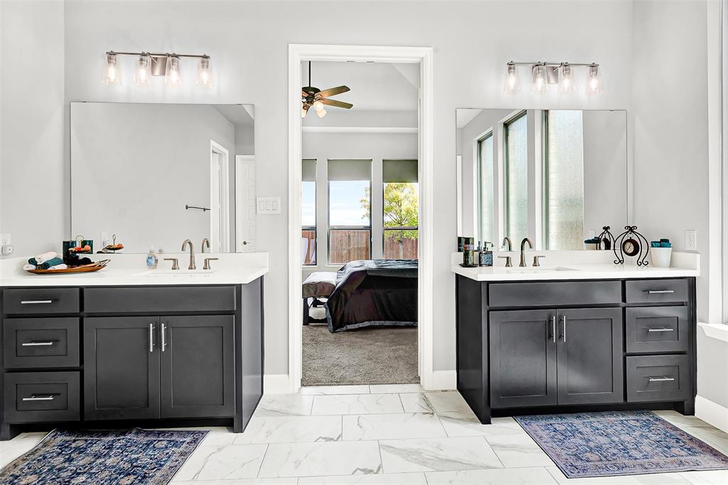 1004 Open Range Drive Mansfield, TX 76063 - Photo 29 of 40 a bathroom with a sink vanity and a mirror