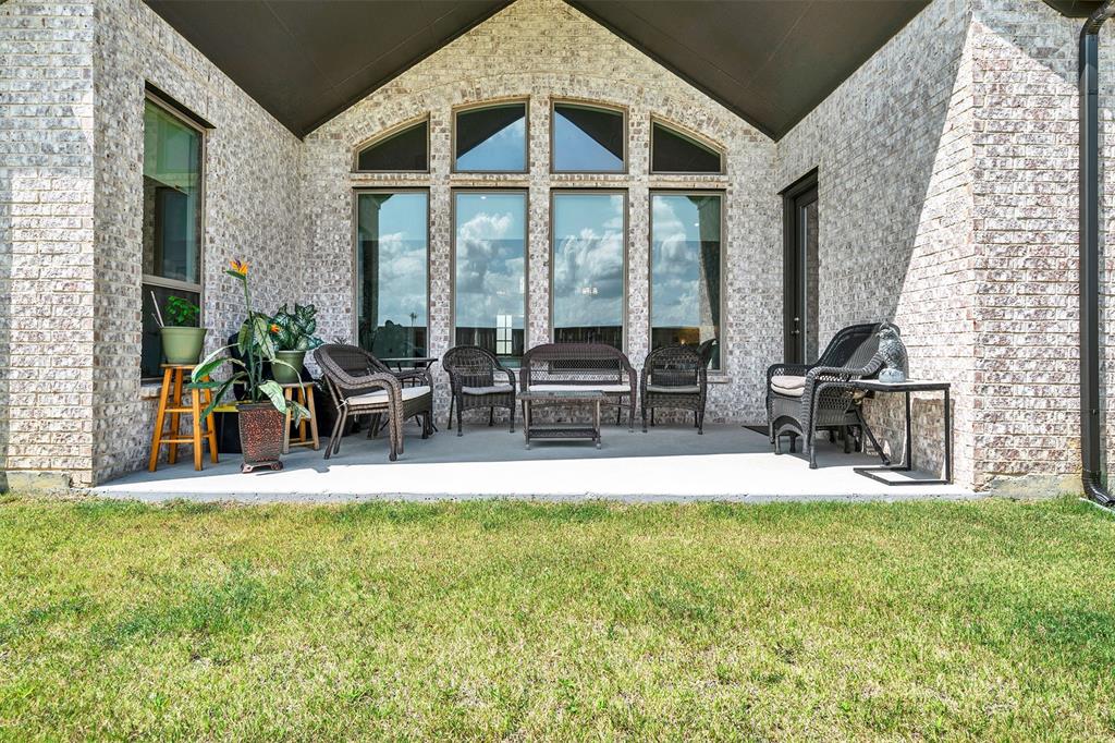 1004 Open Range Drive Mansfield, TX 76063 - Photo 34 of 40 a view of a house with backyard porch and sitting area