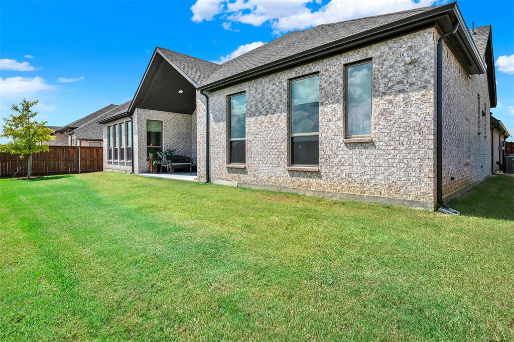 1004 Open Range Drive Mansfield, TX 76063 - Photo 35 of 40 a view of a house with backyard and garden