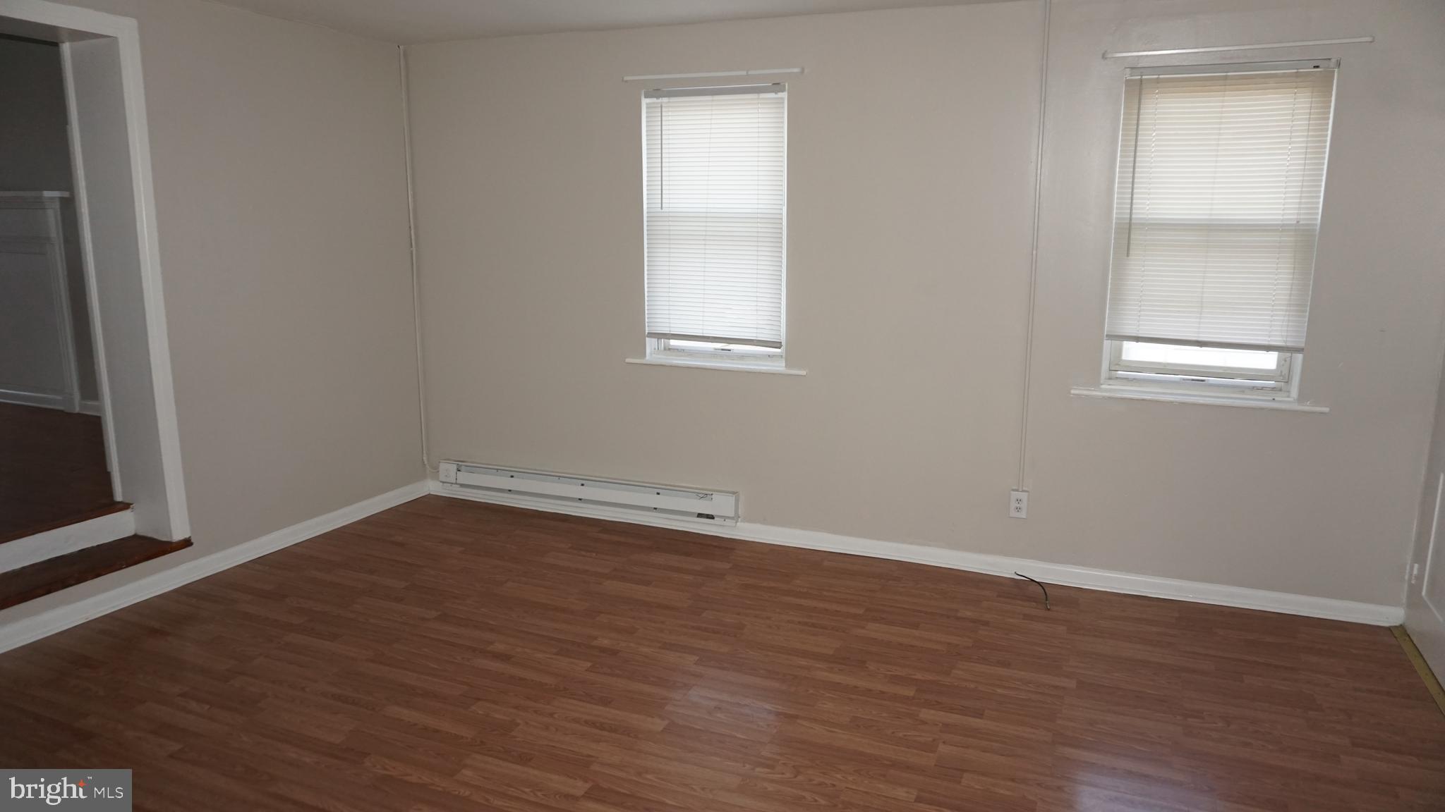 276 East Main Street, Unit 4 Westminster, MD 21157 - Photo 11 of 26 an empty room with wooden floor and windows