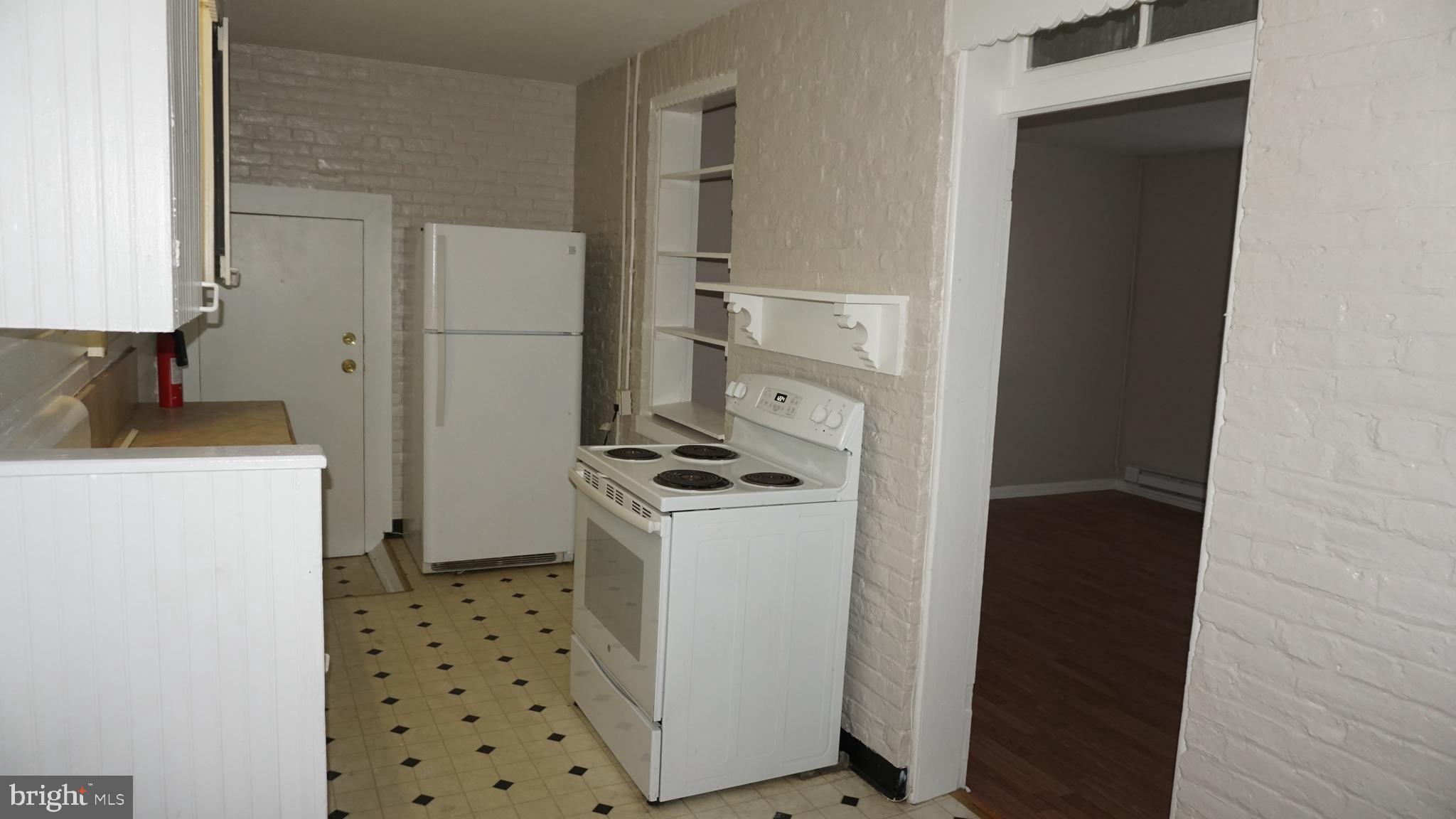 276 East Main Street, Unit 4 Westminster, MD 21157 - Photo 5 of 26 a kitchen with a stove a refrigerator and a sink