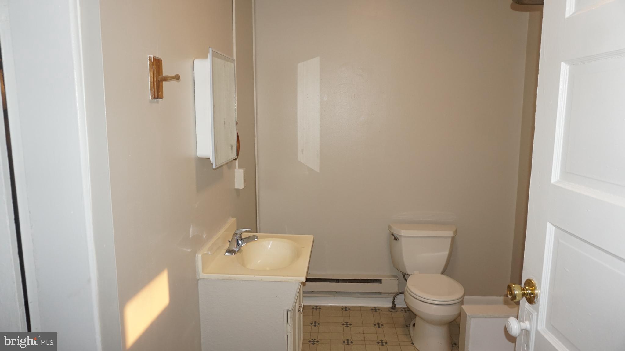 276 East Main Street, Unit 4 Westminster, MD 21157 - Photo 8 of 26 a bathroom with a sink toilet and shower